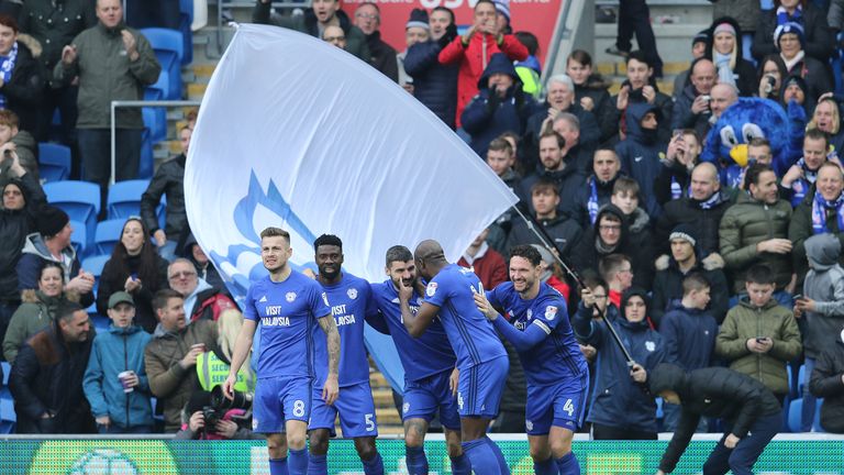 Cardiff City players celebrate with Callum Paterson after he makes it 1-0