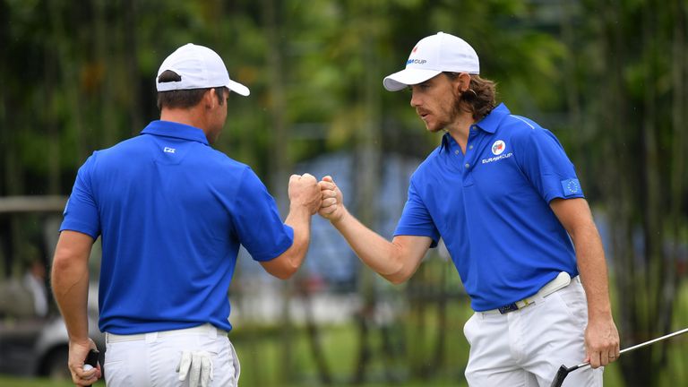 Tommy Fleetwood celebrates victory in the top match with Paul Casey