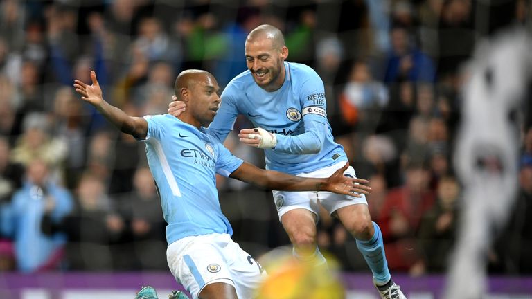 Fernandinho celebrates his side's opening goal with team-mate David Silva