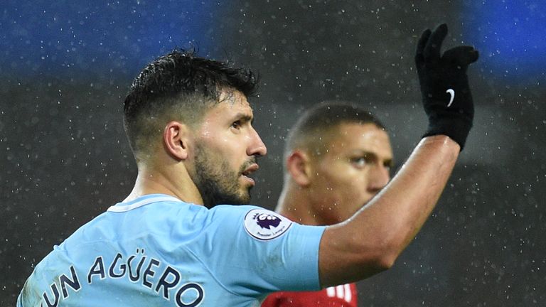 Sergio Aguero celebrates scoring Manchester City's third goal against Watford
