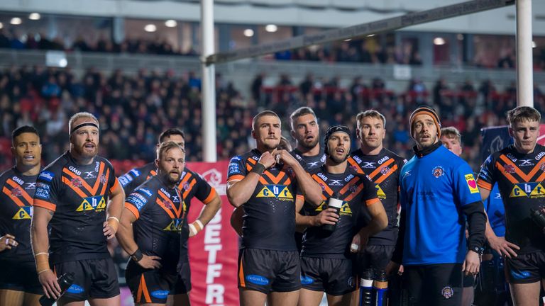 Castleford look on dejected as they concede another try against St Helens.
