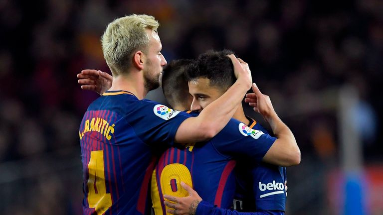 Philippe Coutinho is congratulated after extending Barca's lead against their neighbours