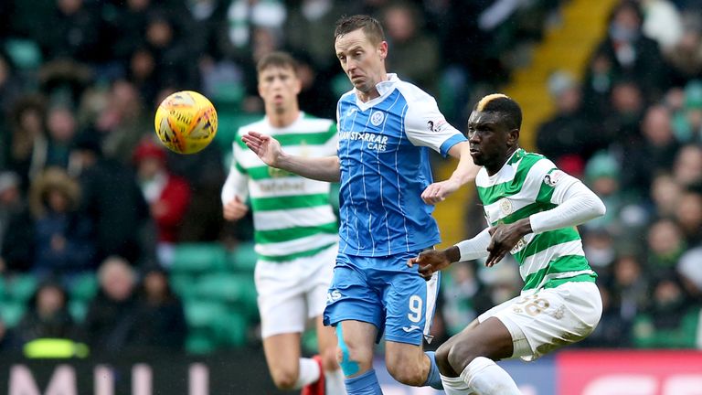 Celtic's Eboue Kouassi (right) and St Johnstone's Steven MacLean battle for the ball