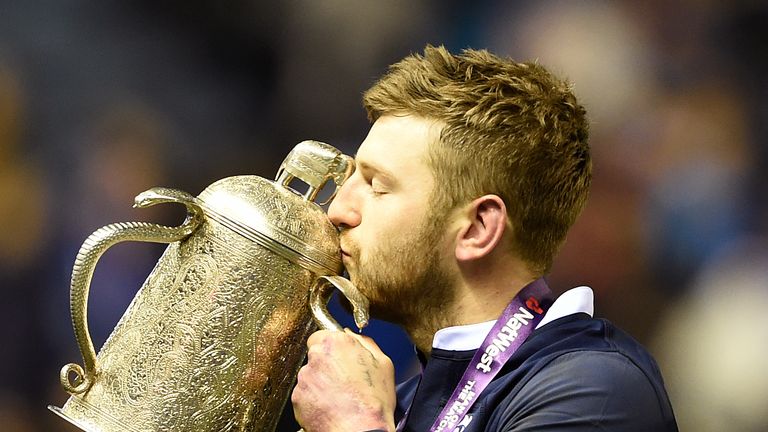 Russell celebrates with the Calcutta Cup