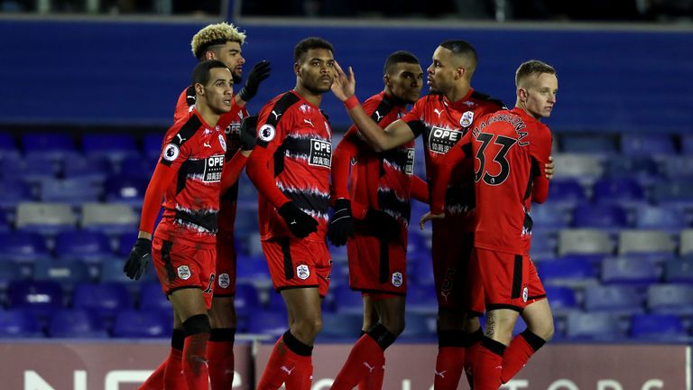 Steve Mounie of Huddersfield Town celebrates with team-mates