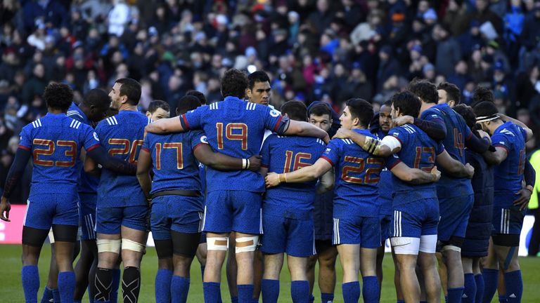France's players huddle after the Six Nations defeat at Murrayfield
