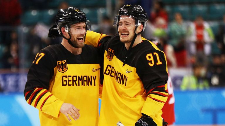Germany celebrate after defeating Canada 4-3 in the men's semi-finals