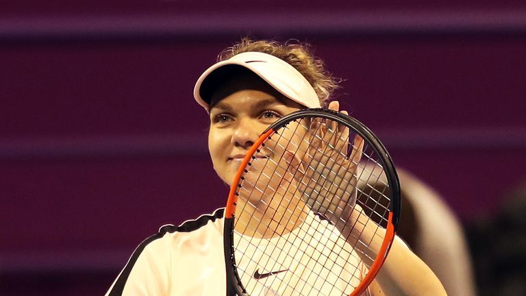 Halep celebrates after beating Ekaterina Makarova