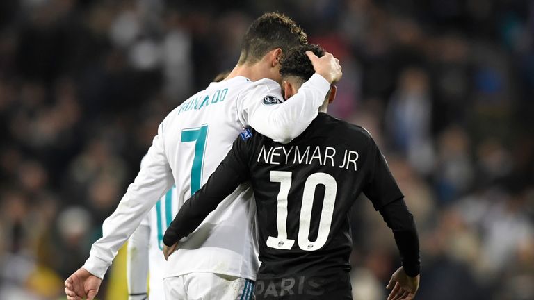 Cristiano Ronaldo (L) and Neymar leave the pitch at half-time during Real's Champions League clash with PSG