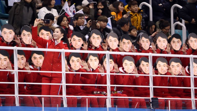 North Korean cheerleaders sing during the women's ice hockey preliminary round - Group B game