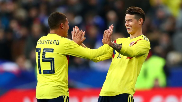 Juan Quintero celebrates with team-mate James Rodríguez after scoring Colombia's winner in Paris