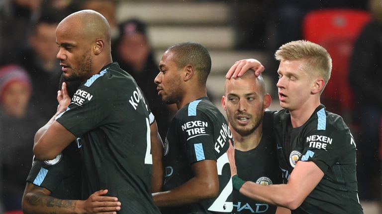 David Silva (centre) is congratulated by his Man City team-mates after opening the scoring 