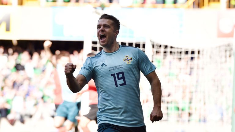 Jamie Ward celebrates after seeing his shot deflected in