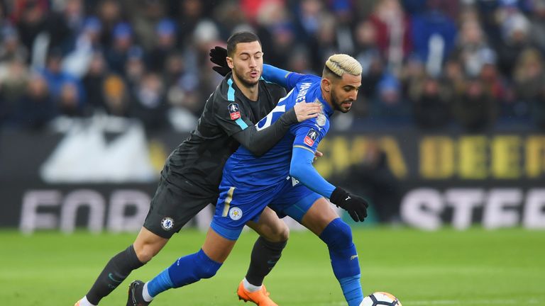 Eden Hazard battles with Riyad Mahrez at the King Power Stadium