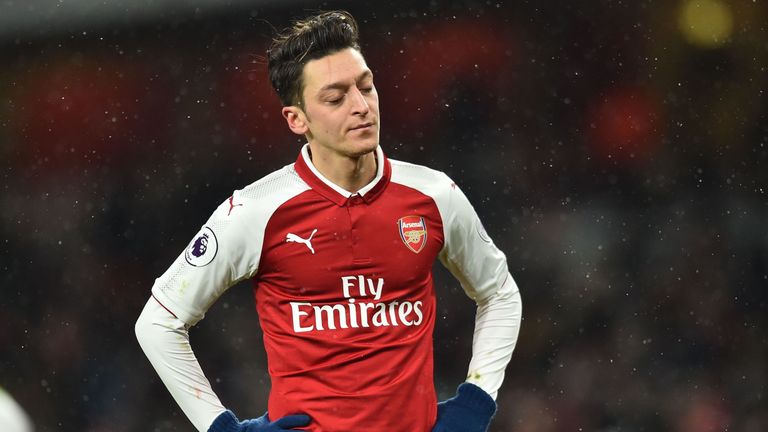 Mesut Ozil looks on during the home defeat to Manchester City