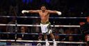 Khan returns with whirlwind win