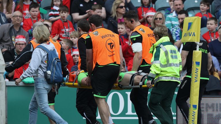 Rob Horne is stretched off in a neck brace at Welford Road