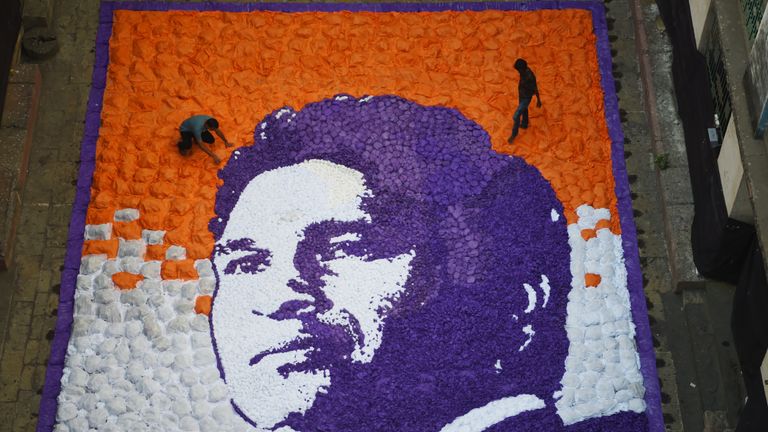 Artists work on an image of Sachin Tendulkar to celebrate his 45th birthday (Credit: AFP)