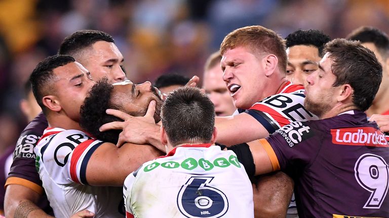 Dylan Napa clashes with Sam Thaiday after Napa was penalised for a high tackle on Korbin Sims