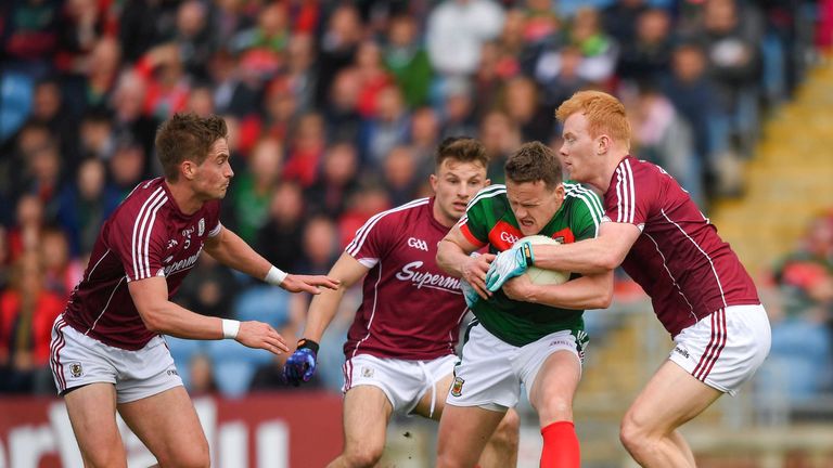 Andy Moran batles with three Galway players.