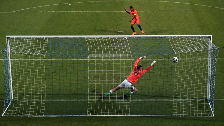 Netherland's Daishawn Redan scores the winning penalty past Oisin McEntee