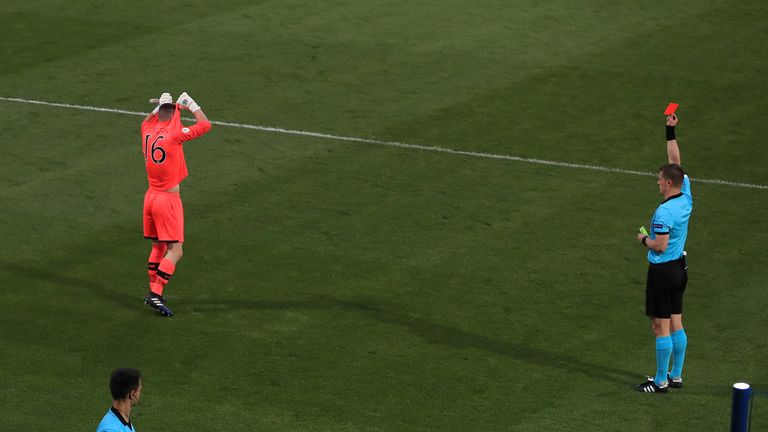 Referee Zbynek Proske sends off Republic of Ireland's goalkeeper James Corcoran during the penalty shoot out