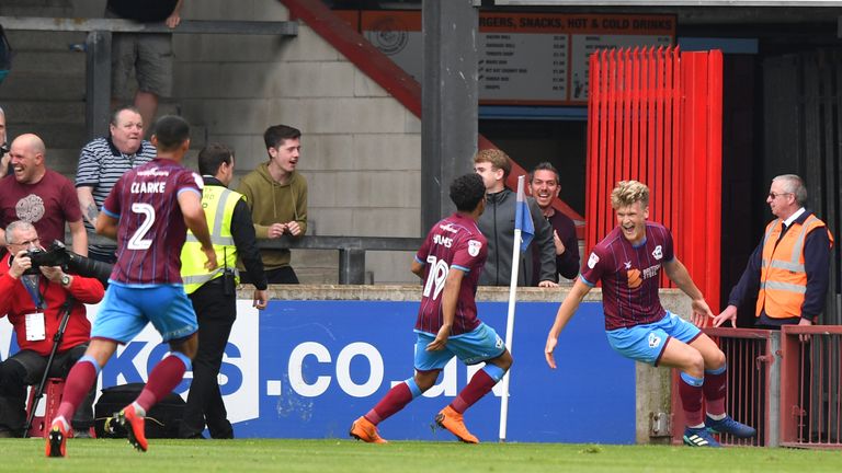 Scunthorpe United's Cameron McGeehan (right) celebrates scoring the equaliser against Rotherham
