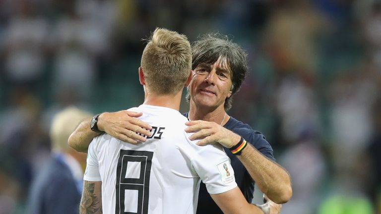 Germany coach Joachim Low hugs match-winner Kroos