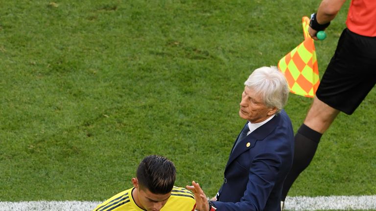   Jose Pekerman consoles James Rodriguez as he is substituted 