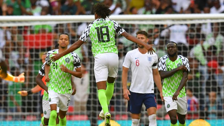 Nigeria midfielder Alex Iwobi (centre) celebrates after scoring against England