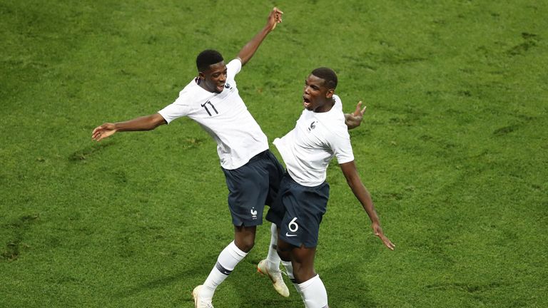 Ousmane Dembele (L) celebrates with France's midfielder Paul Pogba after scoring a goal