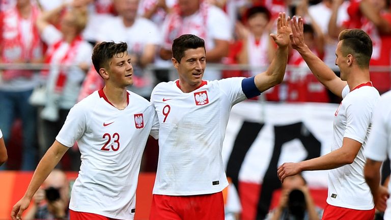 Robert Lewandowski celebrates his double against Lithuania