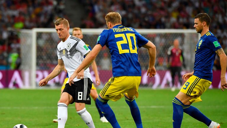 Toni Kroos takes on Ola Toivonen in the first half