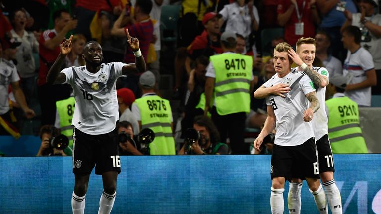 Toni Kroos and Marco Reus spared Germany's World Cup blushes with goals in the second half to seal a 2-1 win over Sweden