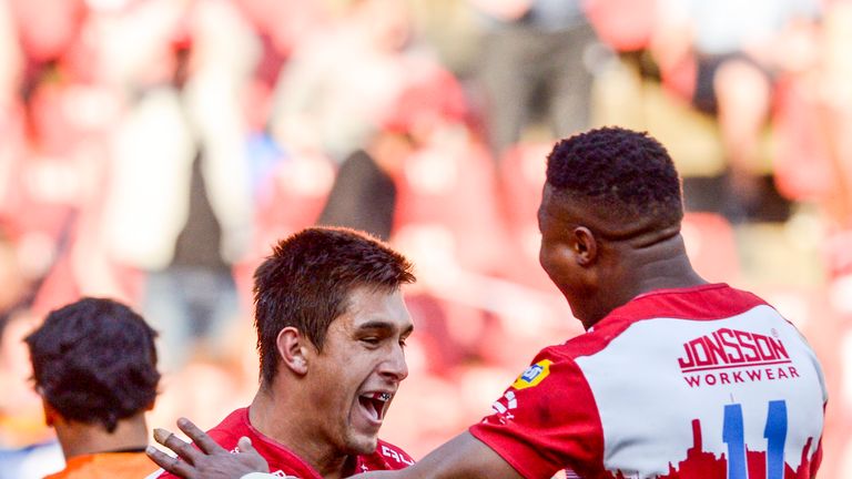   Harold Foster celebrates with Aphiwe Dyantyi after scoring an essay 