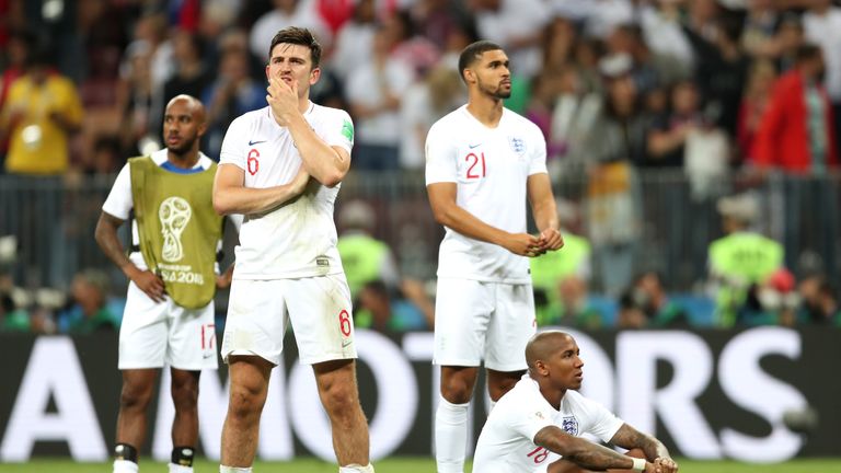 England players stand dejected following the 2-1 loss to Croatia in Moscow