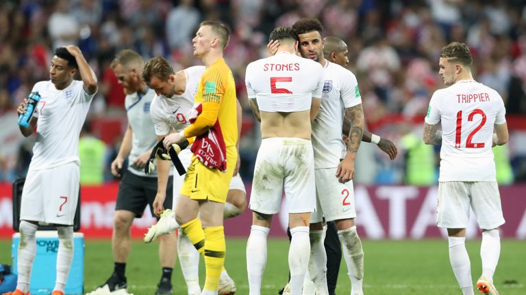 John Stones is consoled by Kyle Walker at full-time following England's 2-1 loss to Croatia in the World Cup semi-final