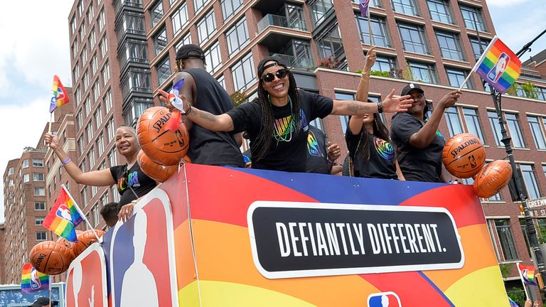Teresa Weatherspoon, one of the WNBA's greatest-ever players, poses for a photo on the parade float