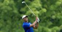 Woods 'not sharp' but fires 66