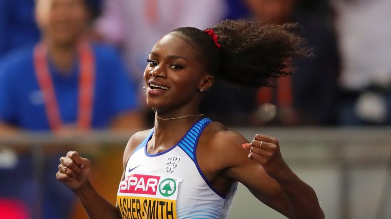 Dina Asher-Smith celebrates winning the gold medal in the women's 200m final