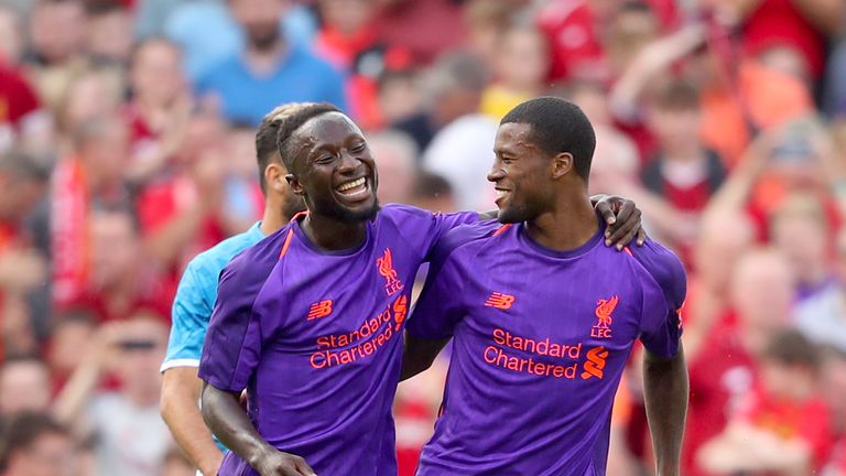 Georginio Wijnaldum (R) celebrates scoring with Naby Keita