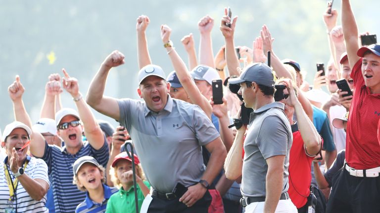 Loud cheers met Rory McIlroy's chip-in at the 14th