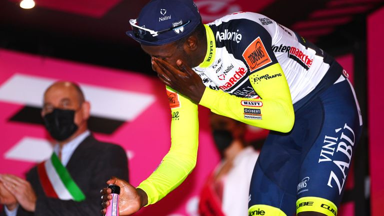 Biniam Girmay: Eritrean makes history as first Black Africa to win Grand Tour stage with Giro d'Italia success - AM Girmay caught himself in the face with the pop of the Prosecco cork