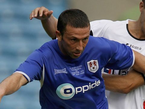 Image of McInnes crossing his fingers