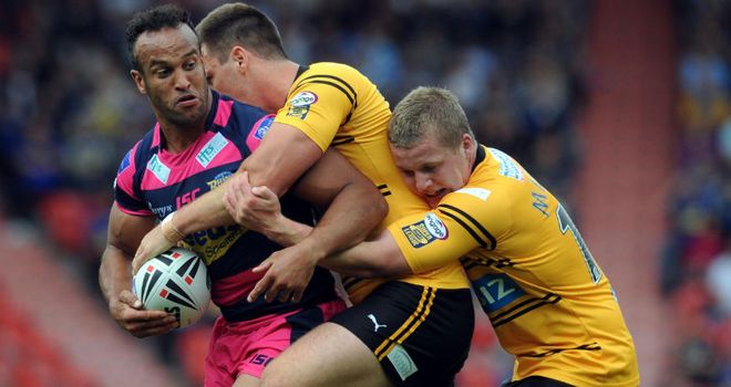 Jamie Jones-Buchanan is tackled by two hungry Tigers