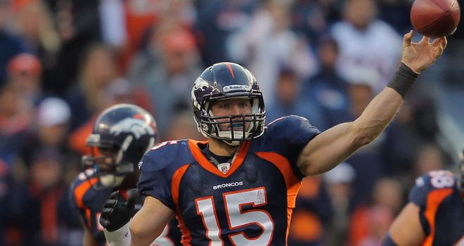 New Denver Broncos starting quarterback Tim Tebow helping Miami