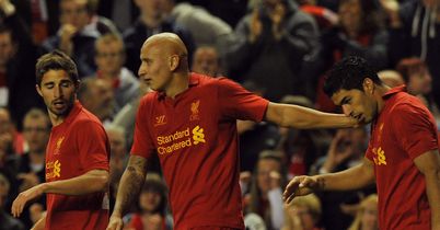 Luis Suarez is congratulated after his winning goal saw Liverpool beat Hearts 2-1 on aggregate to progress to the Europa League group stages.