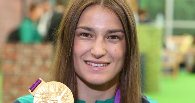 Katie Taylor: Poses with her gold medal as she prepares to fly back to Ireland