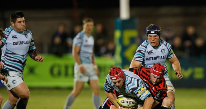 Rob Andrew of Leicester is halted by the Saracens defence