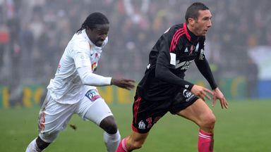 Bernard Mendy gives chase to Morgan Amalfitano